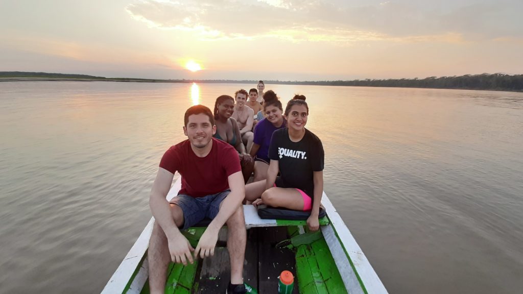Holy Cross students with our cultural advisor, Luis, enjoying the sunset over the river.